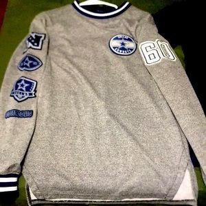 sleeping a small Dallas cowboys sweatshirt